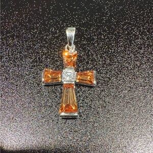 Gorgeous 925 silver cross with garnet colored stones